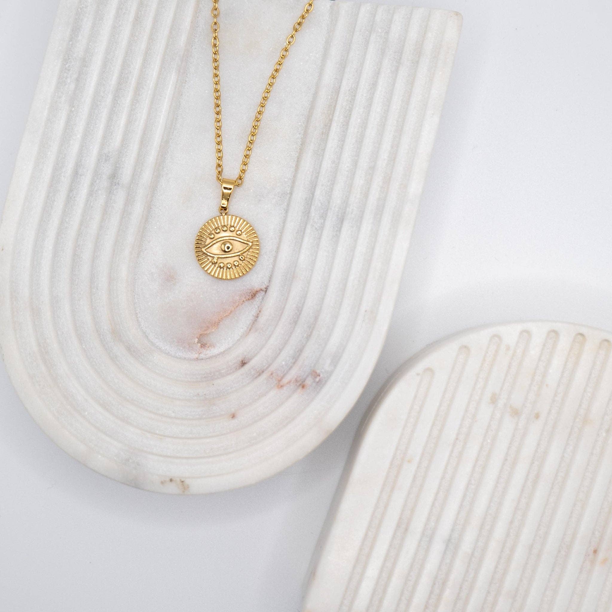 Necklace with "Devil's Eye" pendant made of 18-karat gold-plated stainless steel