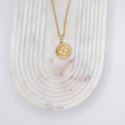 Necklace with "Devil's Eye" pendant made of 18-karat gold-plated stainless steel