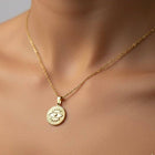 Necklace with "Devil's Eye" pendant made of 18-karat gold-plated stainless steel